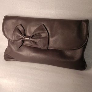 Vintage leather clutch with bow.